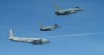 NATO's Swedish Gripens and German Eurofighters shadow Russian spy plane over Baltic Sea.