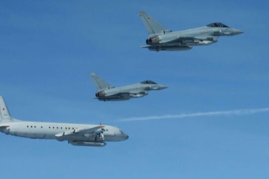 NATO's Swedish Gripens and German Eurofighters shadow Russian spy plane over Baltic Sea.
